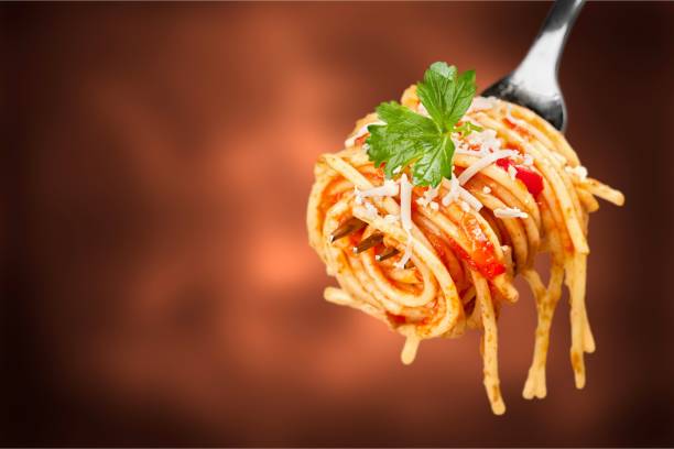 Pasta. Fork with just spaghetti around spaghetti stock pictures, royalty-free photos & images