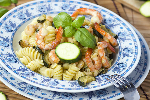 Pasta with  Shrimp and zucchini stock photo