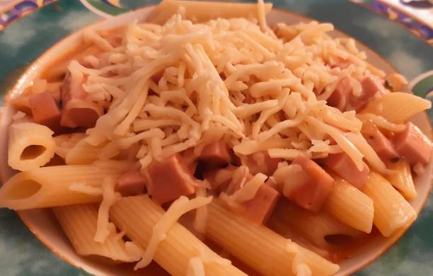 pasta with tomato sauce and grated cheese stock photo
