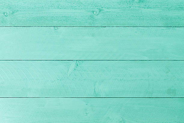 Pastel green stained wood background texture stock photo