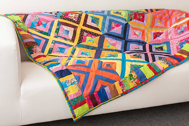 Patchwork quilt. Part of blanket as background. stock photo