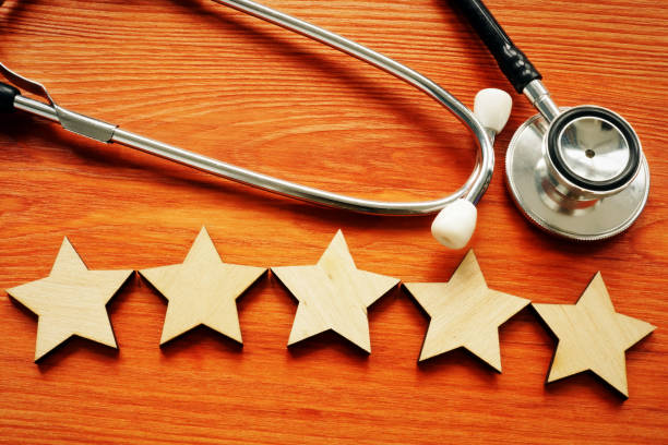 Patient experience and satisfaction concept. Stethoscope and five stars. Patient experience and satisfaction concept. Stethoscope and five stars. quality stock pictures, royalty-free photos & images