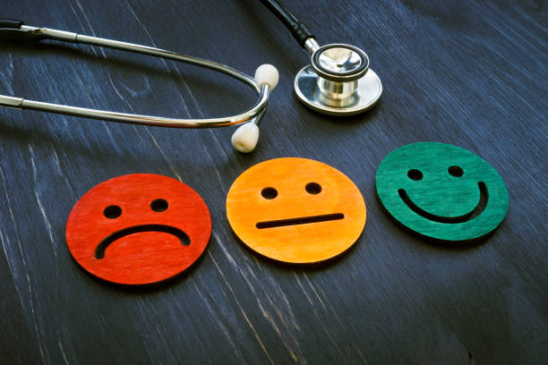 Patient experience concept. Stethoscope and smiled faces for hospital consumer assessment. stock photo