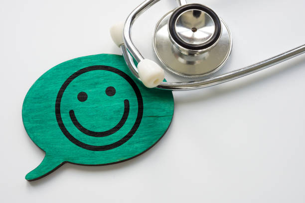 Patient satisfaction concept. Stethoscope and smiley face. stock photo