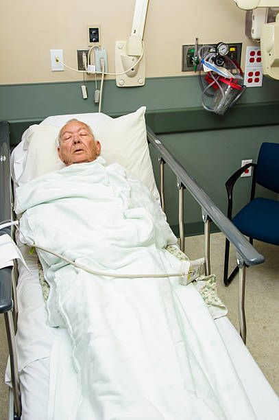 Patient sleeping in recovery room stock photo