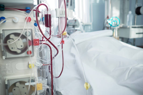 Patient with coronavirus infection in critical stance.Intensive care emergency room with hemodialysis machine or hemofiltration procedure. stock photo