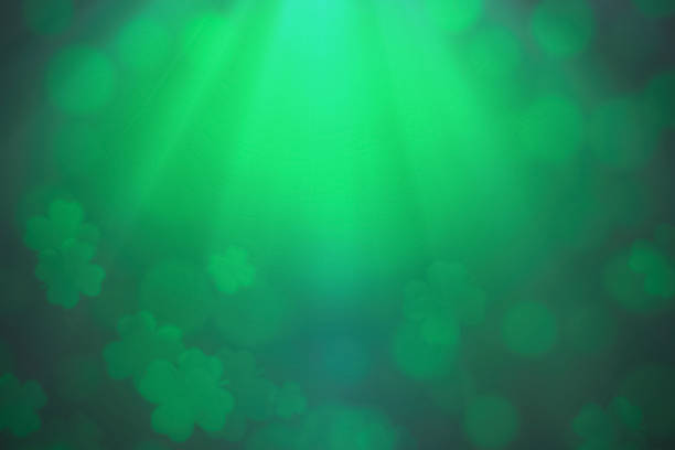 ST Patrick's day background green clover leaf bokeh lights defocused for ST Patrick's day celebration design background stock photo