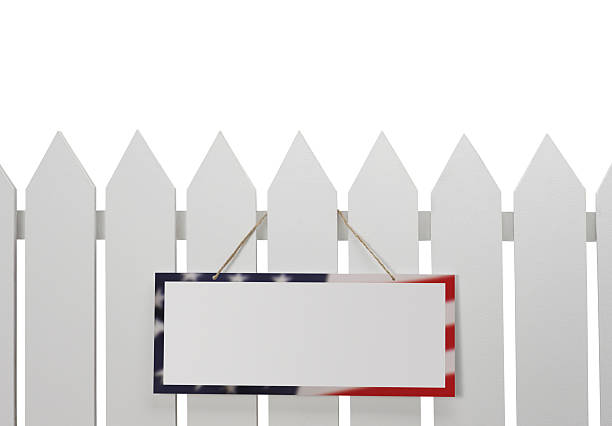 Patriotic Sign on White Picket Fence stock photo