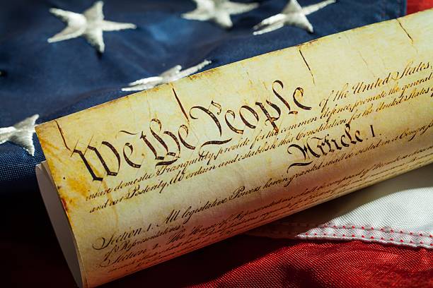 Patriotism The American Constitution on American Flag american revolution stock pictures, royalty-free photos & images
