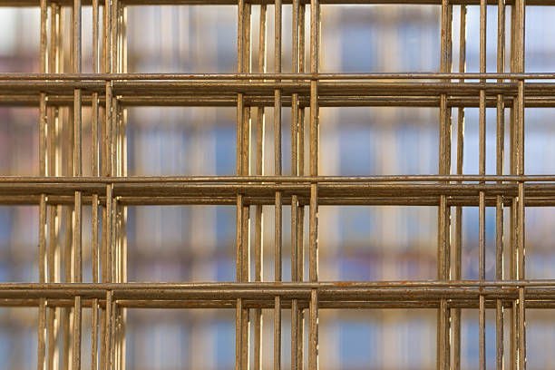 Pattern from stack of rebar grids at the construction site Pattern from stack of rebar grids at the construction site on blue background linkage effect stock pictures, royalty-free photos & images