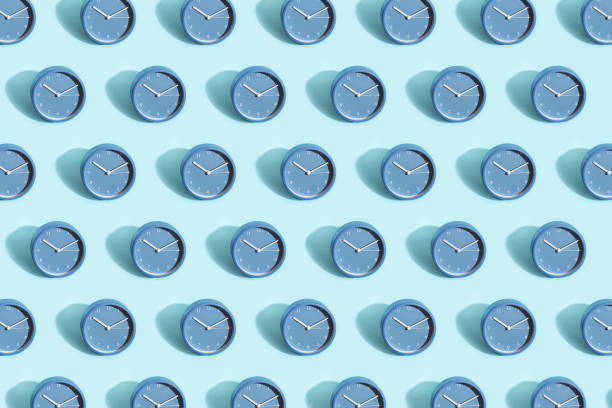 Pattern made of blue clock on pastel blue background. Trendy pattern made of blue clock on pastel blue background. clock photos stock pictures, royalty-free photos & images