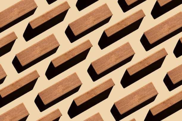 Pattern of small rectangular wooden blocks on beige background. sustainable lifestyle and biophilic design concept. Zero waste, plastic free, sustainable, minimalism. stock photo