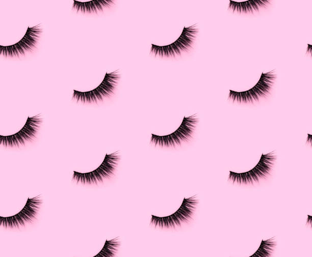 Pattern with eyelashes on pink background Pattern with eyelashes on pink background.  Flat lay top view minimal template feminine greeting card. eyelash stock pictures, royalty-free photos & images