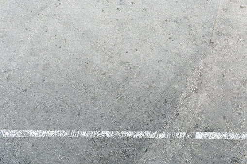 Pavement or concrete wall texture with different shades of gray