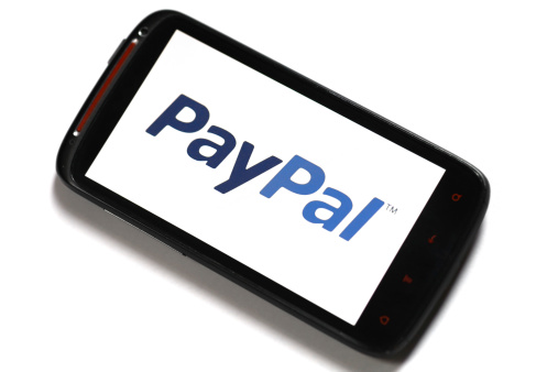 Bucharest, Romania - June 23, 2012: Android smartphone with the PayPal logo displayed on the screen using a picture viewing software. PayPal is the most popular online payment service, allowing payments and money transfers to be made through the Interne.
