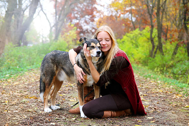 Peaceful Happy Woman Hugging German Shepherd Dog While stock photo