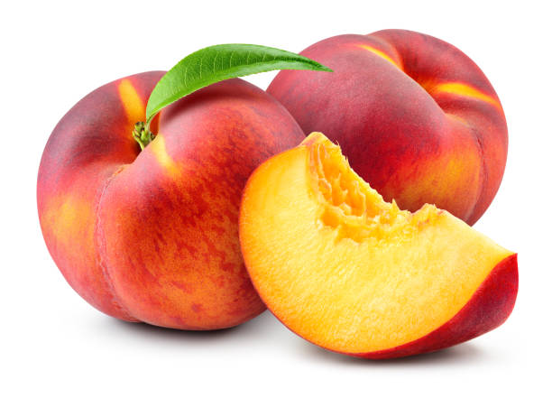 Peach isolate. Peach with slice on white background. Full depth of field. With clipping path. Peach isolate. Peach with slice on white background. Full depth of field. With clipping path. peach stock pictures, royalty-free photos & images