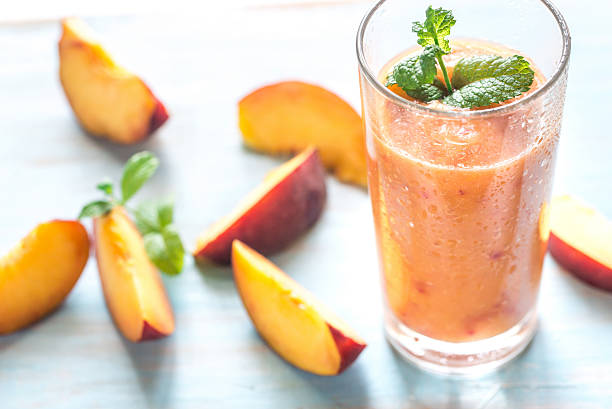 Peach smoothie Peach smoothie peach smoothie stock pictures, royalty-free photos & images