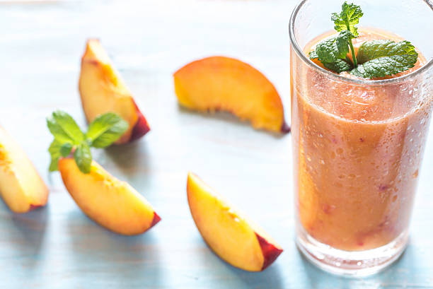 Peach smoothie Peach smoothie peach smoothie stock pictures, royalty-free photos & images