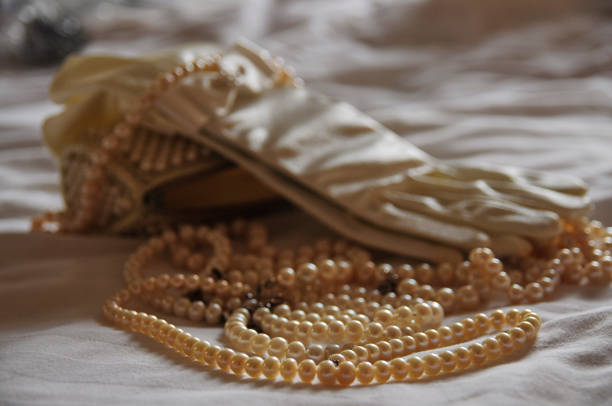 Pearl necklace of a glove and handbag stock photo