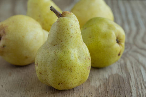 Pears on rustic wood background stock photo