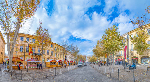 pedestrian zone with christmas market booths along the historic buildings in  Aix-en-Provence stock photo