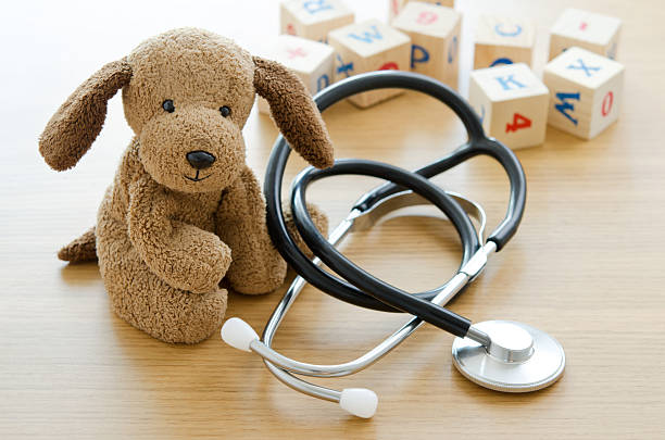 Pediatrics Puppy toy with medical equipment pediatrician stock pictures, royalty-free photos & images