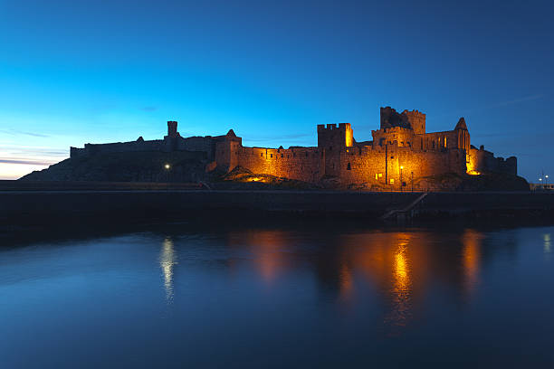 Peel Castle at night, Isle of Man stock photo