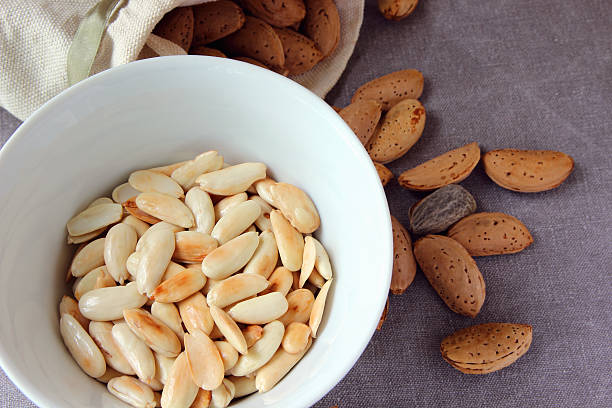 Peeled almonds in a bowl.. stock photo