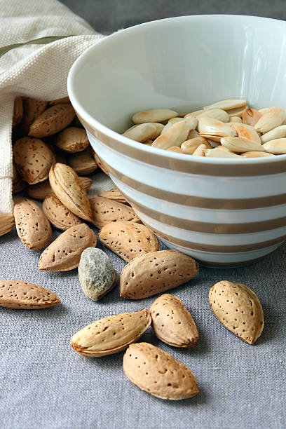Peeled almonds in a bowl.. stock photo