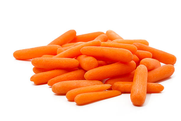 peeled baby carrots stock photo