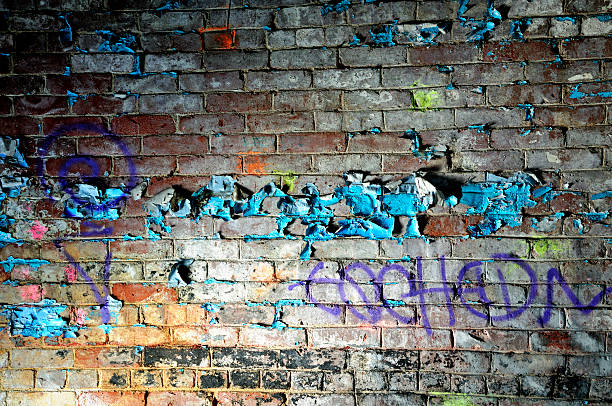 Peeling Paint on Graffiti Wall stock photo