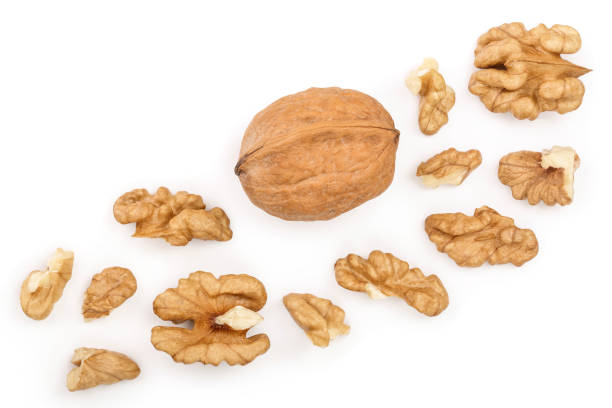 peelled walnuts isolated on white background with copy space for your text. top view. flat lay - nozes imagens e fotografias de stock