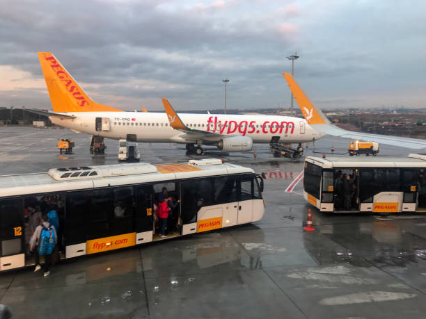 Pegasus airlines plane and transfer buses stock photo