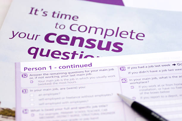 Pen over purple and white census forms Blank UK Census formSimilar here: census stock pictures, royalty-free photos & images