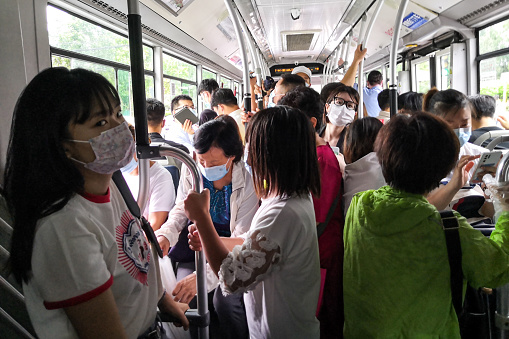 Peopel commuting on bus to work in the morning of working day amid coronavirus pandemic in Beijing, China.