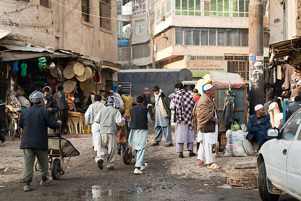 People at a back alley street corner in Kabul stock photo