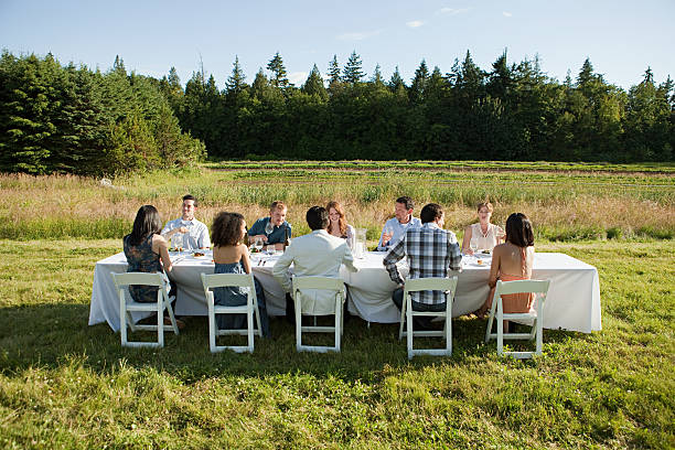 People at dinner party on a farm