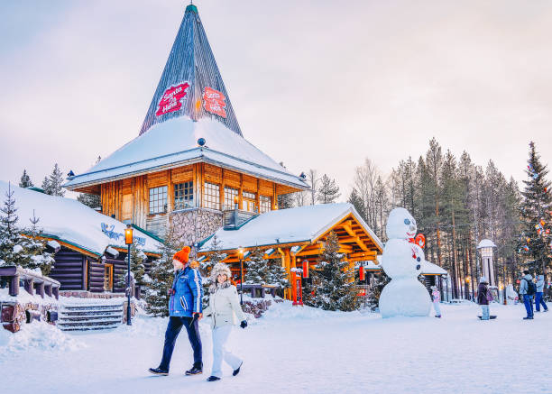 People at Santa Claus Village in Rovaniemi in Lapland Finland Rovaniemi, Finland - March 5, 2017: People at Santa Claus Village in Rovaniemi in Lapland in Finland. finnish lapland stock pictures, royalty-free photos & images
