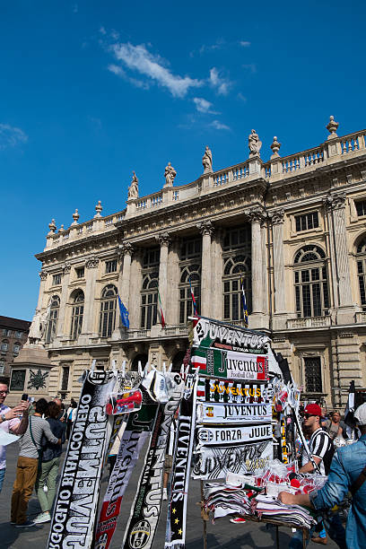 People celebrating 32° Scudetto for Juventus Football Club Turin, Italy - May 18, 2014: People celebrating 32nd Scudetto won by Juventus Football Club in Piazza Castello. The center of Turin. The background is Palazzo Madama. juventus stock pictures, royalty-free photos & images