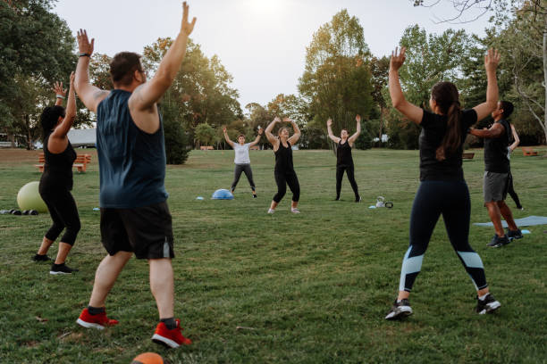 People doing functional training in the park stock photo