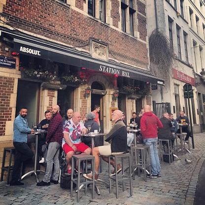 Brussels, Belgium - September 16, 2017: People enjoying drinks at the bar, sitting outside.