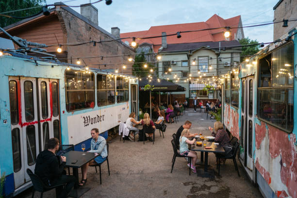People enjoying summer evening in an outdoor cafe stock photo