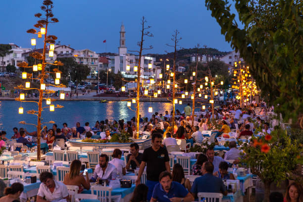 People enjoying twilight time at the restaurans on the beach in Datca stock photo