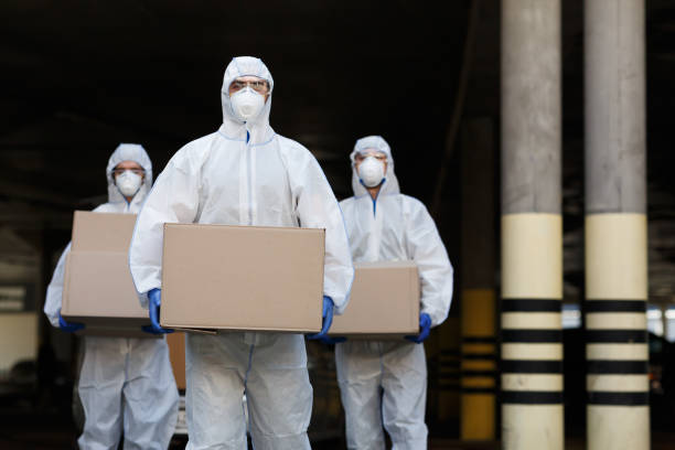 People in protective suits and masks delivering vaccine People in protective suits and masks delivering vaccine of coronavirus to population sending stock pictures, royalty-free photos & images