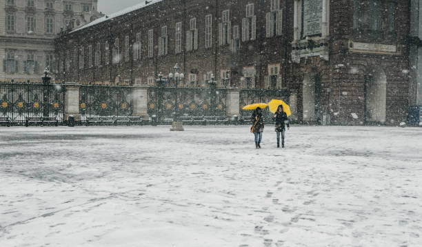 People in the city street under the snow stock photo