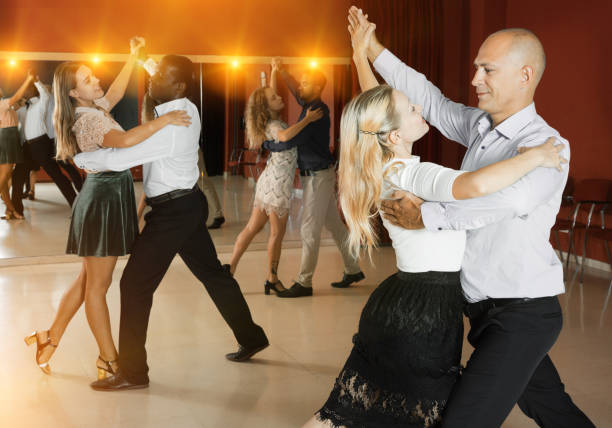 People learning to dance waltz stock photo