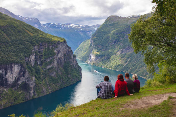People looking at the Geirangerfjord, Norway stock photo