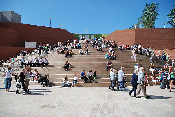 People on Liverpool One mall big staircase. Liverpool, England - May 31, 2008: People on Liverpool One mall big staircase. People walking and sit on the main staircase of the recently opened new shopping center. Liverpool stock pictures, royalty-free photos & images