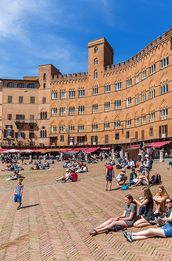 Siena, Italy - April 20, 2016: People on the Piazza del Campo in Siena, Italy
